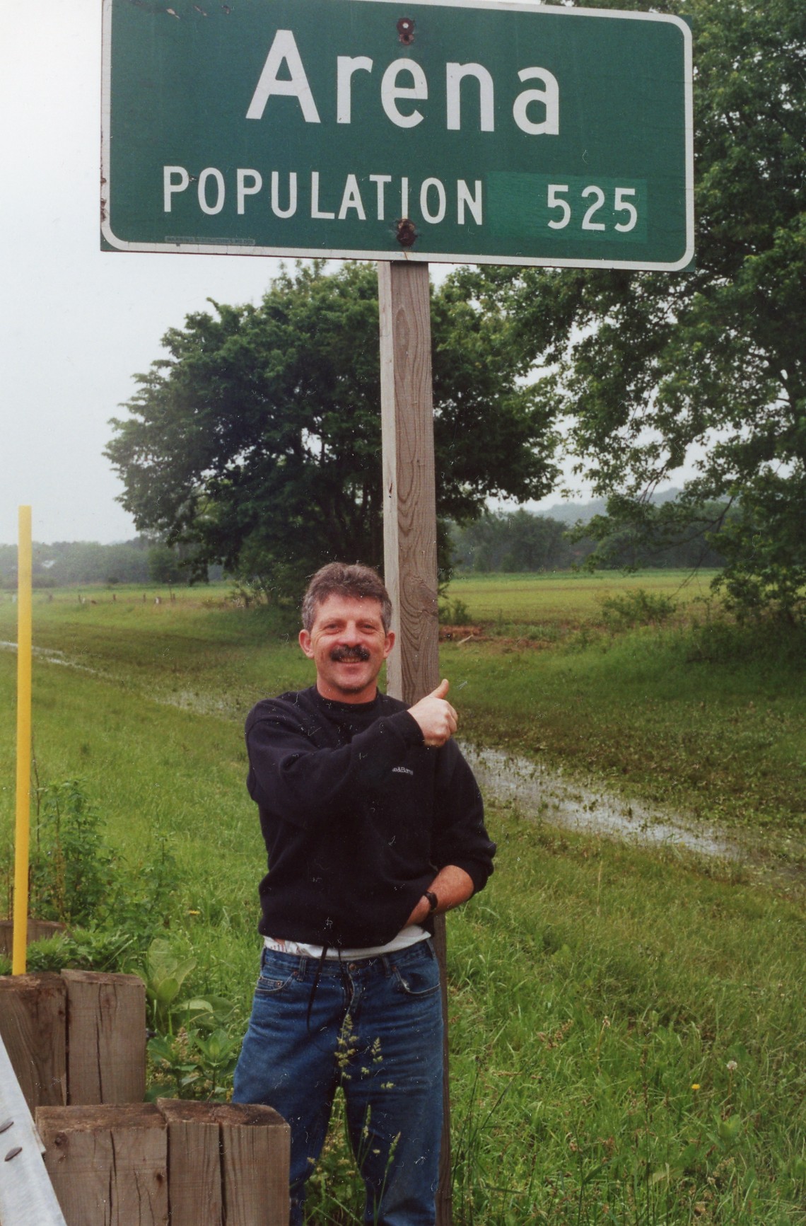 Francesco posing in front of the Arena, Wisconsin town sign
