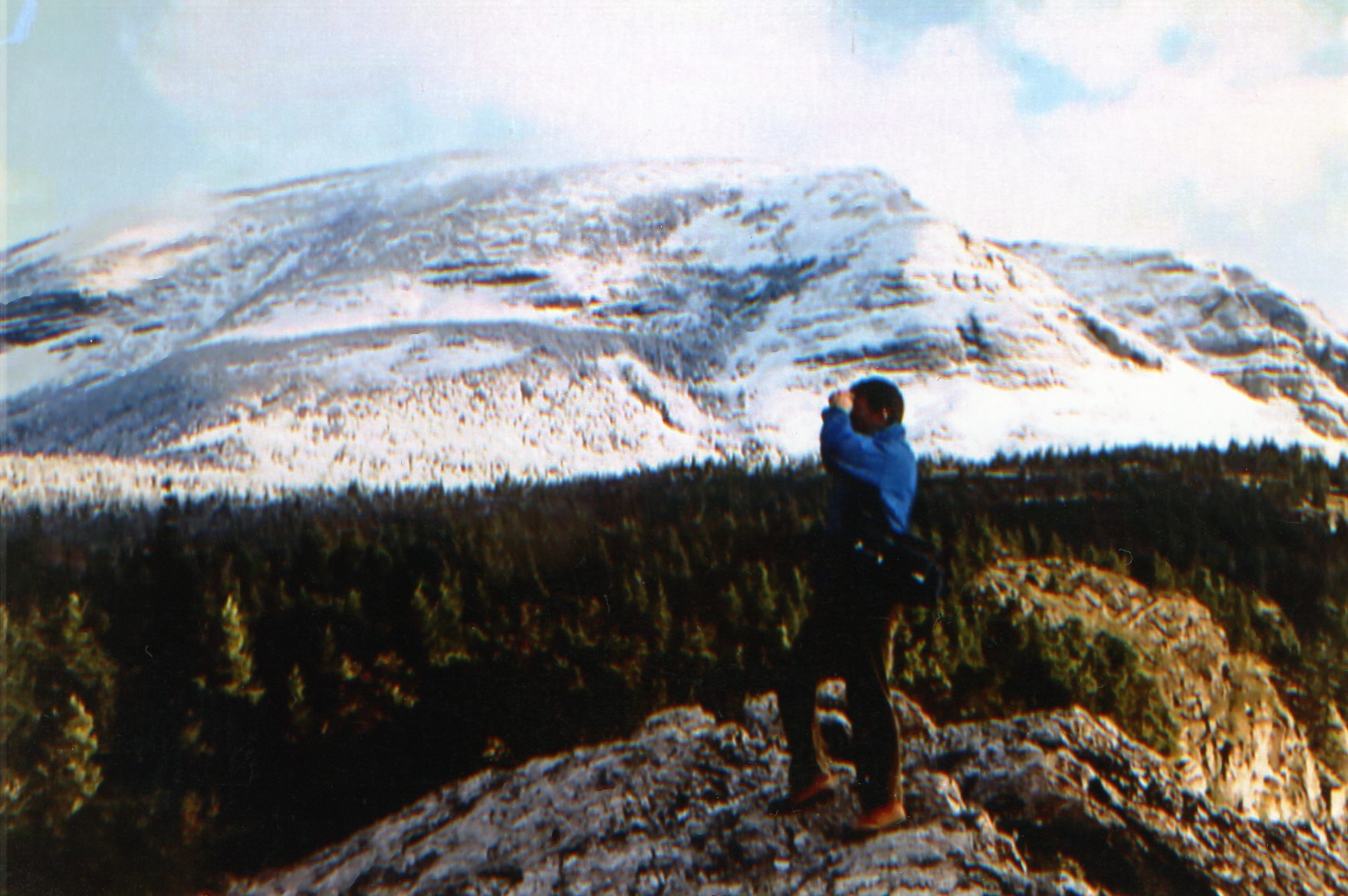 Francesco taking a photo on a mountain 