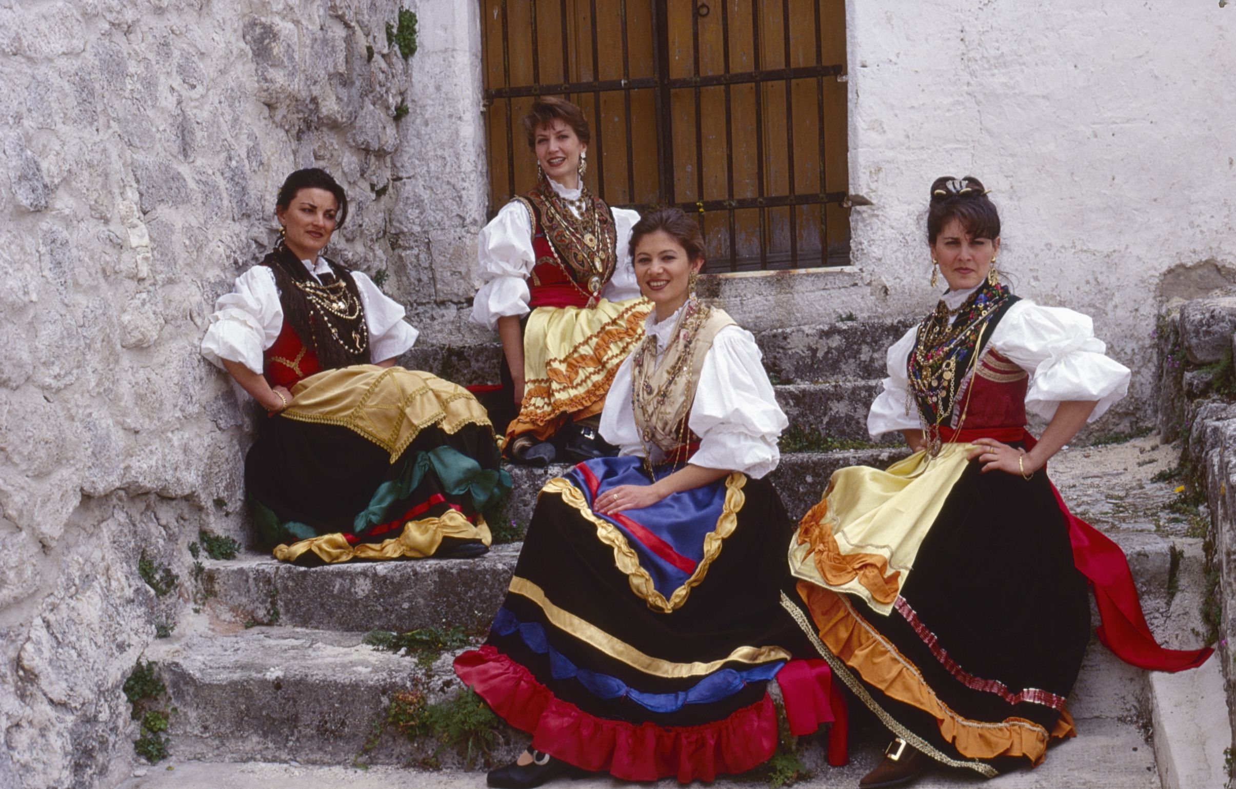 A group of pacchianelle dancers in traditional costumes in Monte Sant'Angelo